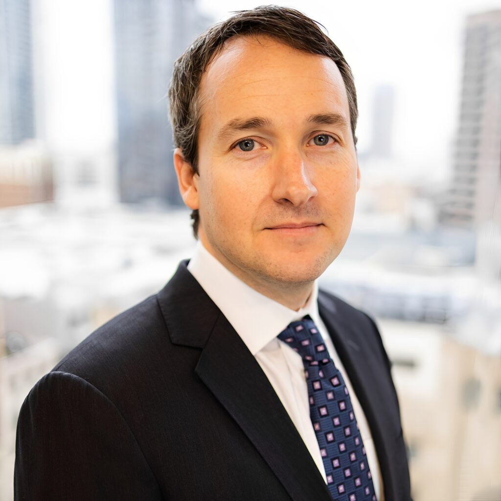 Businessman in suit with city background
