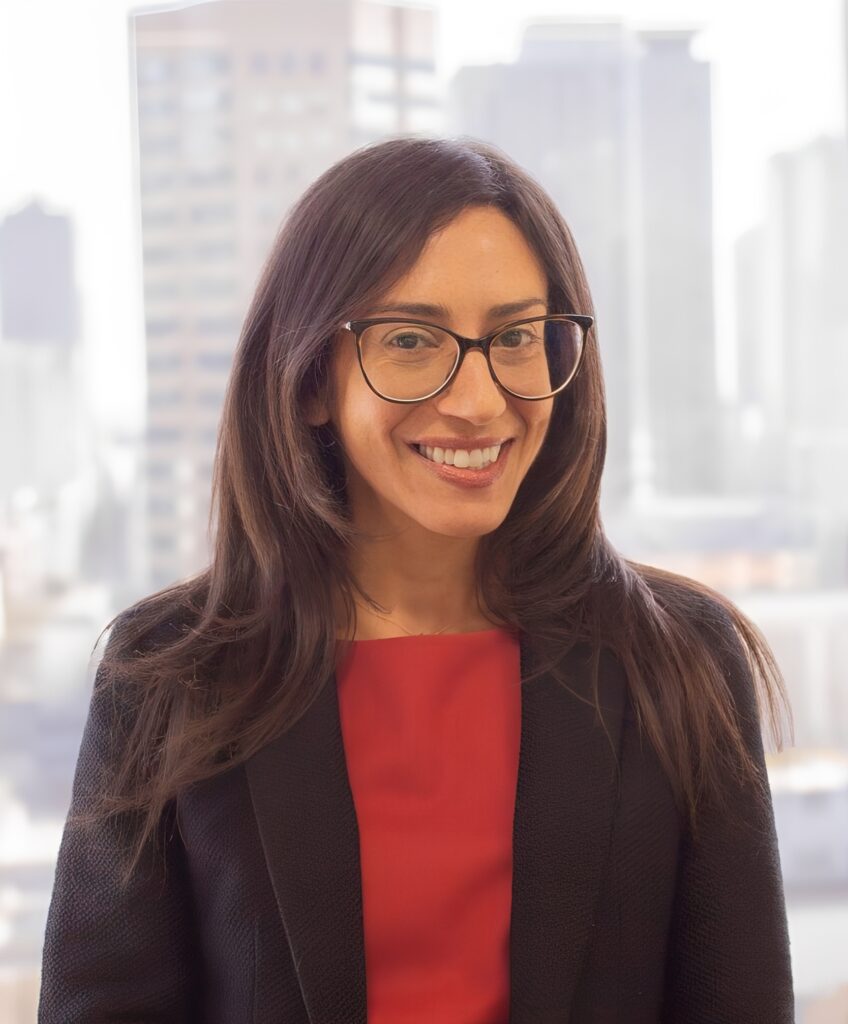 Woman in red shirt and blazer