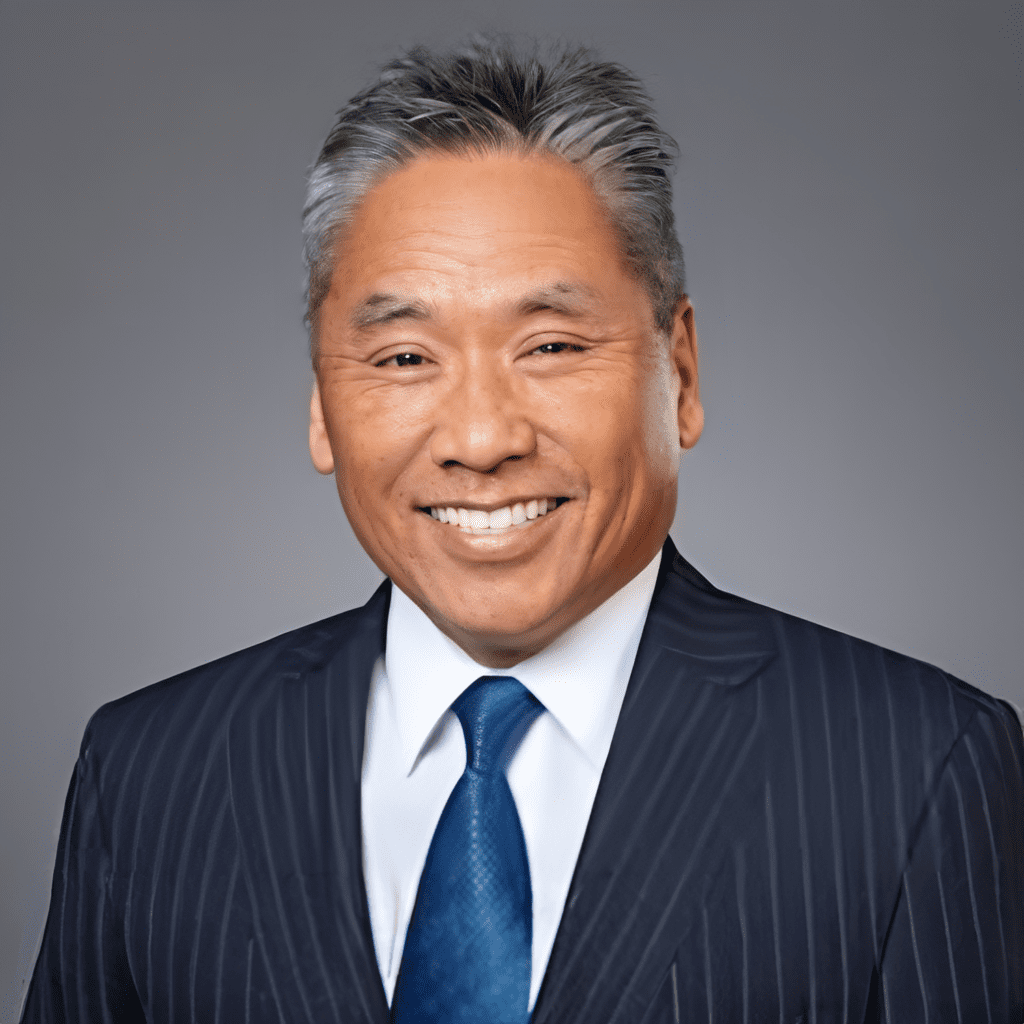 Professional portrait of a smiling gentleman.