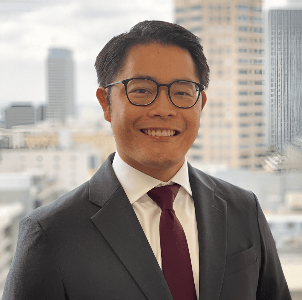 Businessman with glasses and maroon tie